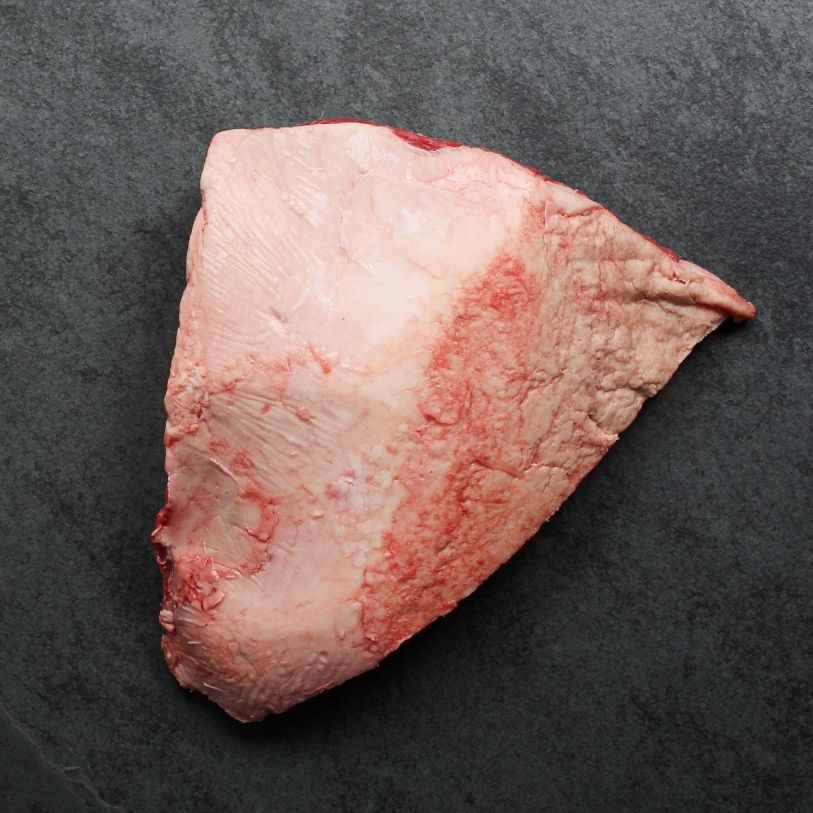 overhead view of the fatty side side of a raw AAA beef picanha roast