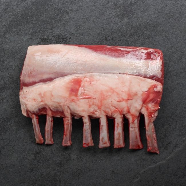 overhead view of the fatty side of an Australian lamb rack with Frenched bones