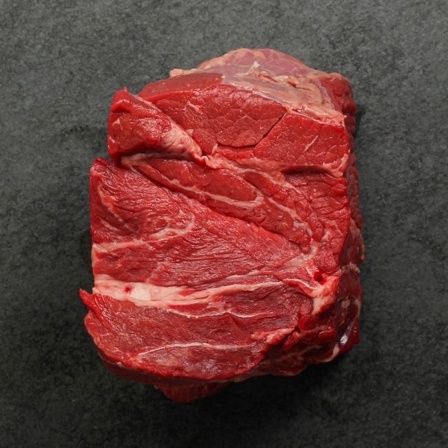 Side view of raw pot roast.
