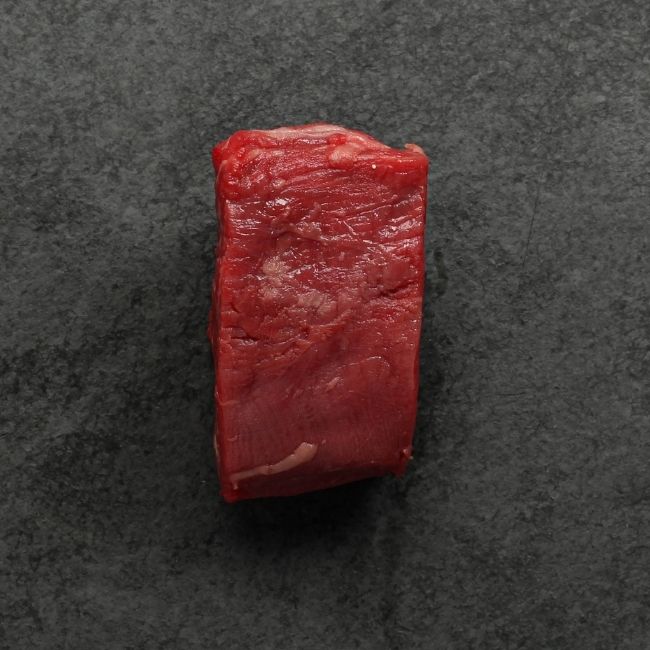 side view of a raw American-Wagyu Hybrid 4 oz filet mignon