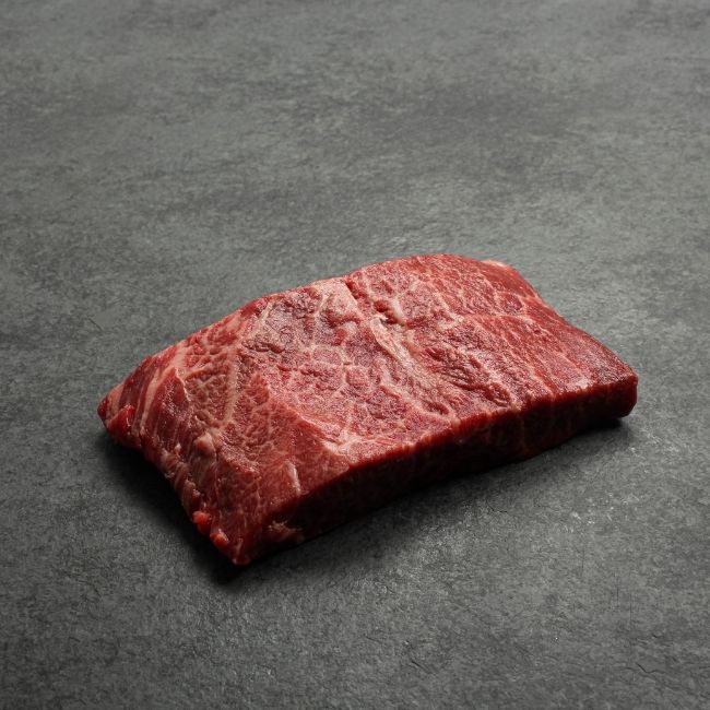 Side view of a raw flat iron steak.