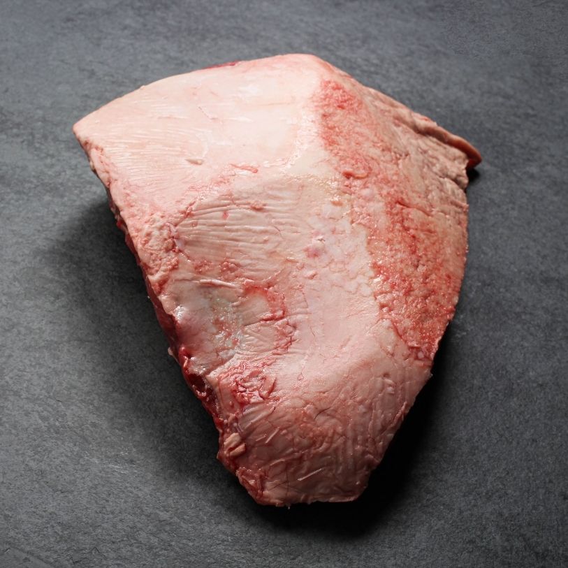 overhead view of the fatty side side of a raw AAA beef picanha roast