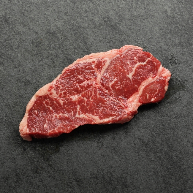 Bottom side of a sandwich steak.