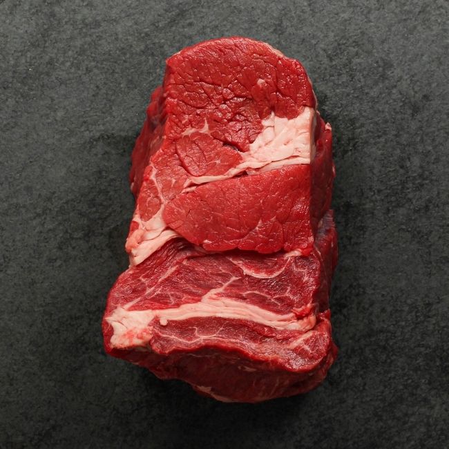 Side view of raw pot roast.