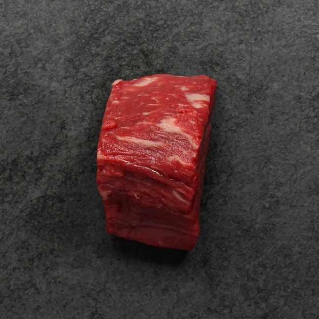 side view of a raw American-Wagyu Hybrid 4 oz filet mignon