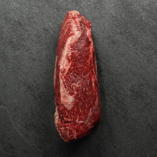 overhead view of the side of a raw wagyu beef sirloin roast