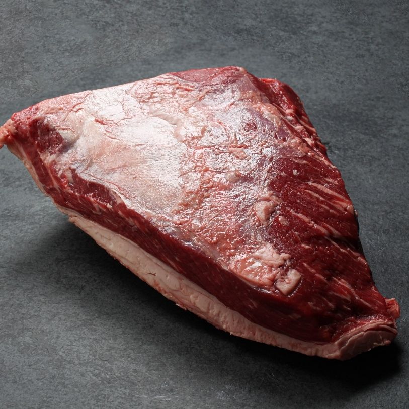 side view of a raw AAA beef picanha roast