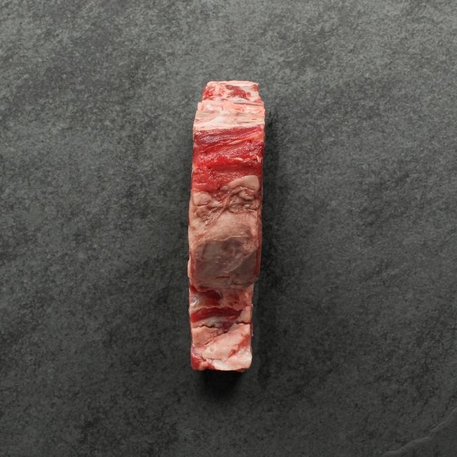 the side of a raw T-bone steak