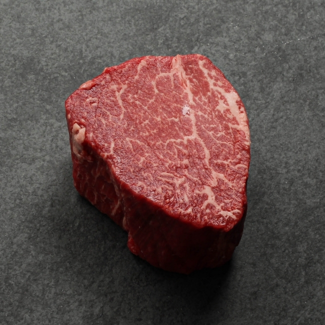 angled view of a heavily marbled australian wagyu filet mignon