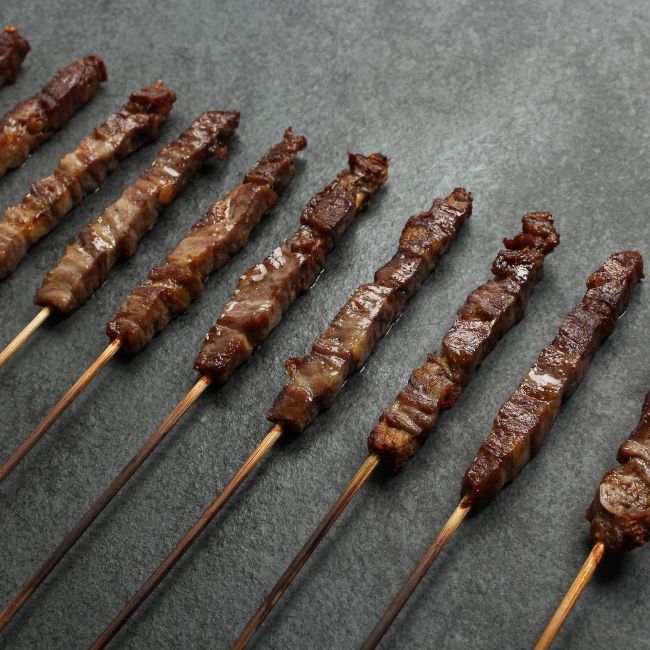 angled view of cooked and browned mini lamb skewers