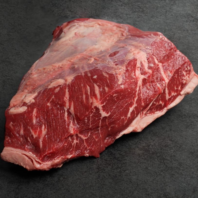 side view of a raw AAA beef picanha roast