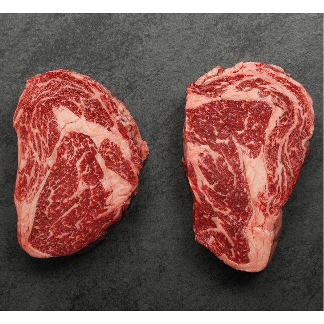 overhead view of two heavily marbled Australian wagyu rib eye steak