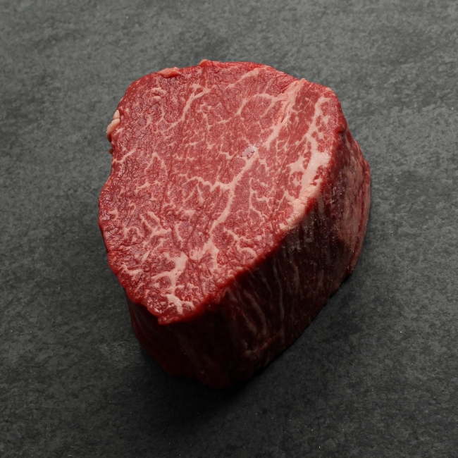 angled view of a heavily marbled australian wagyu filet mignon