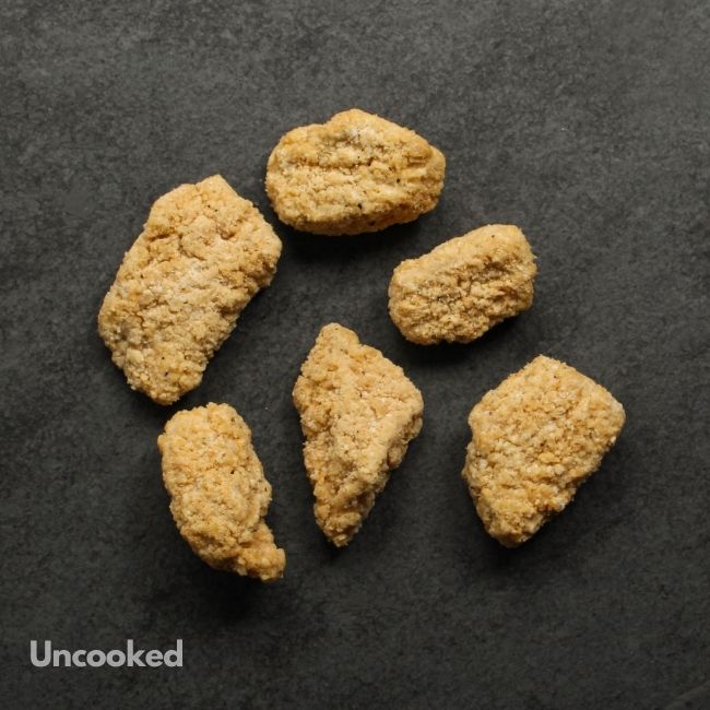overhead view of raw crispy breaded chicken bites