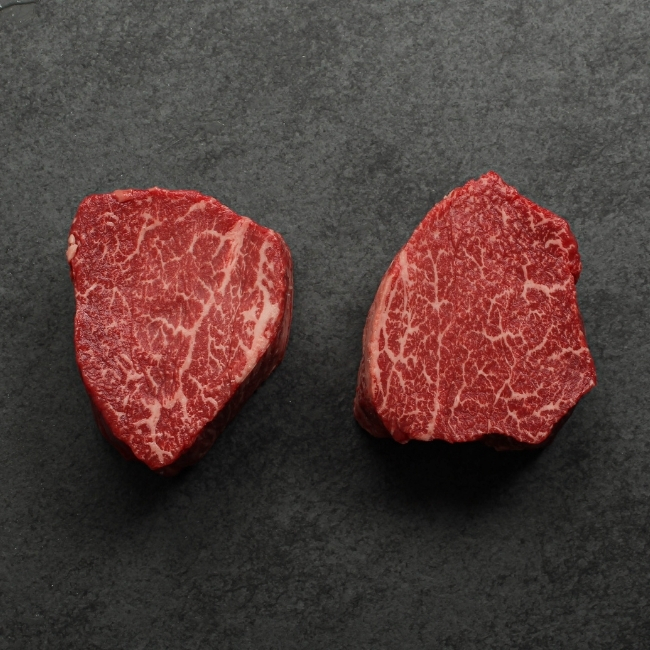 overhead view of two heavily marbled australian wagyu filet mignon steaks