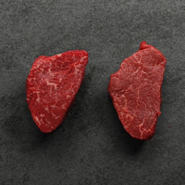 overhead view of two raw American-Wagyu Hybrid 4 oz filet mignon steaks