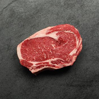 Overhead view of raw bone in rib steak.